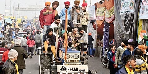 Farmers drive a tractor at Ghazipur border in Delhi on Sunday. (Photo | Parveen Negi, EPS)