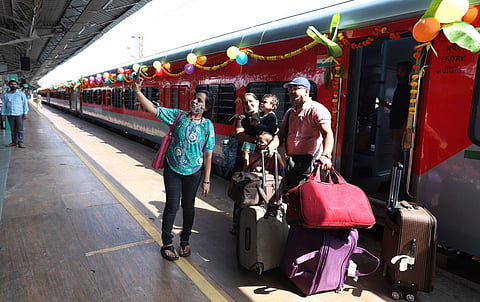 Passengers take a selfie in front of the new train bound for Kevadiya in Gujarat on Sunday. PM Narendra Modi had earlier flagged off the train. (Photo | Ashwin Prasath, EPS)