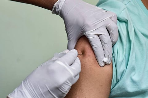 A medic administers COVID vaccine. (File Photo | PTI)