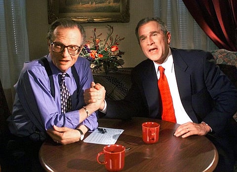 In this Dec. 16, 1999 file photo, Republican presidential candidate Texas Gov. George W. Bush jokes with CNN's Larry King after finishing the 'Larry King Live' show. (Photo | AP)