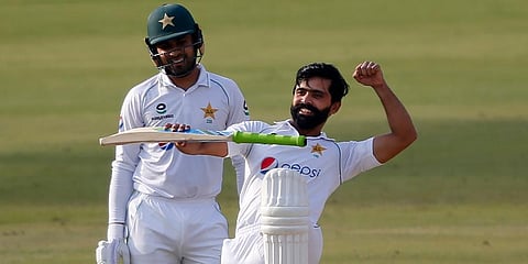Pakistan's Fawad Alam (R) celebrates after scoring century while Faheem Ashraf watches during the second day of the first Test match against South Africa at the National Stadium. (Photo | AP)