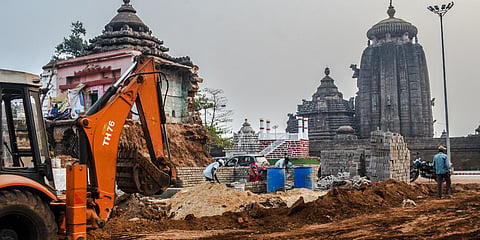 A JCB is used to level land near the Suka-Sari temple complex on Thursday. (Photo| Biswanath Swain, EPS)