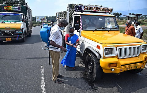 Vehicles entering Tamil Nadu via Walayar check post at outskirts of Coimbatore have been allowed only after disinfecting. (Photo | A Raja Chidambaram, EPS)