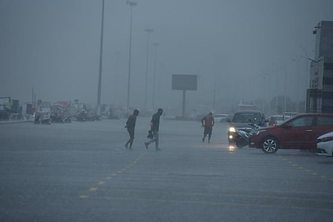 People take shelter at Marina beach as heavy rains lashed Chennai. (Photo | R Satish Babu, EPS)
