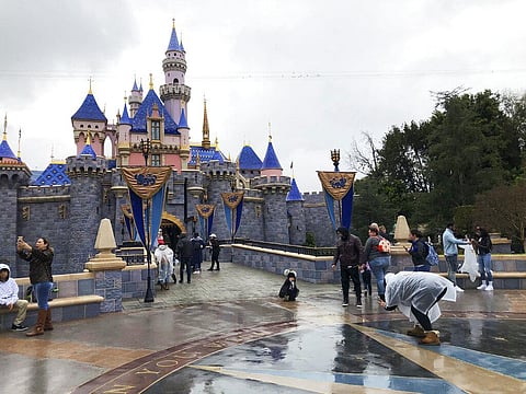 Visitors take photos at Disneyland in Anaheim, Calif. (FIle Photo | AP)