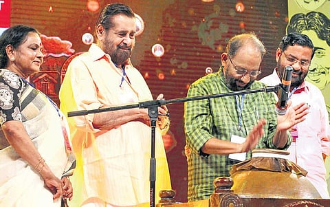 Nedumudi Venu playing mizhavu at Natanam Venulayam programme organised by the film fraternity to celebrate his 40th year in cinema held at Nishagandhi auditorium in Thiruvananthapuram. Actors Madhu,