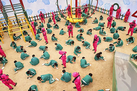This undated photo released by Netflix shows a scene of contestants vying to win the Dalgona Korean candy challenge in a scene from 'Squid Game.' (Photo | AP)