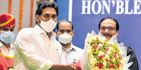 Andhra Pradesh CM YS Jagan Mohan Reddy greets Justice Prashant Kumar Mishra during the later’s swear-in ceremony in Vijayawada on Wednesday. (Photo | EPS)