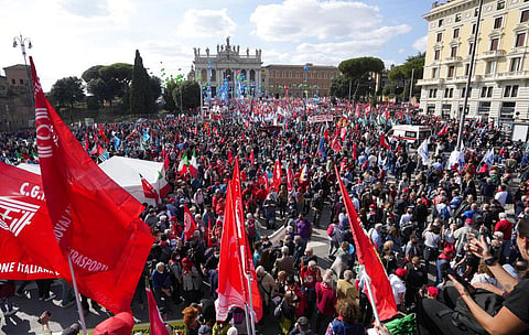 Demonstrators take part in a march organized by Italy's main labor unions, in Rome's St. John Lateran square, Saturday, Oct. 16, 2021. (Photo | AP)