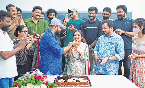 Anna Ben, who bagged the Kerala film award for Best Actor (Female) for her performance in Kappela, celebrates with film director Vysakh and co-stars at the set of her upcoming movie on Saturday