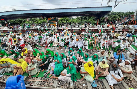 Protestors block railway tracks at Bahadurgarh, Haryana in protest against Lakhimpur Kheri incident, on Monday. (Photo | EPS/Shekhar Yadav)