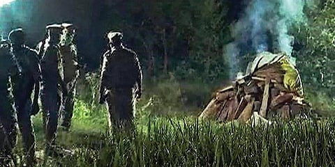 Police cremate the body of the gang-rape victim in the middle of the night in Hathras district in UP. (File Photo | PTI)