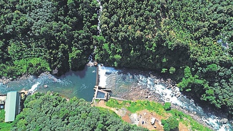 A view of CIAL’s hydropower plant across the Iruvazhinji river at Arippara. (Photo | EXPRESS)