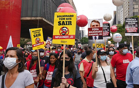Demonstrators gather during a protest against Brazilian President Jair Bolsonaro, calling for his impeachment. (Photo | AP)