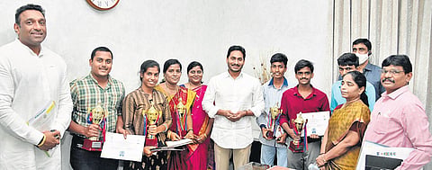 Chief Minister YS Jagan Mohan Reddy congratulates toppers of AITT exam from Andhra Pradesh at Tadepalli on Friday I Express