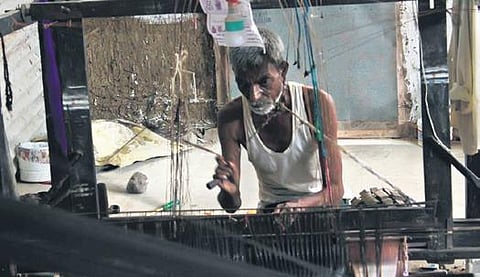 A weaver creates Guledgudda Khana on his loom in Bagalkot district. (Photo | Express)