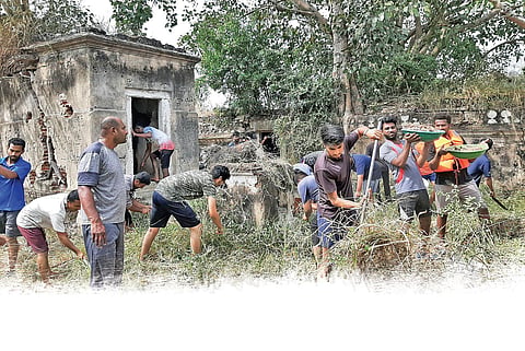 National Service Scheme (NSS) volunteers, students, civil servants and competitive exam aspirants together clean the kalyani at Jakkanahalli village in Srirangapatna