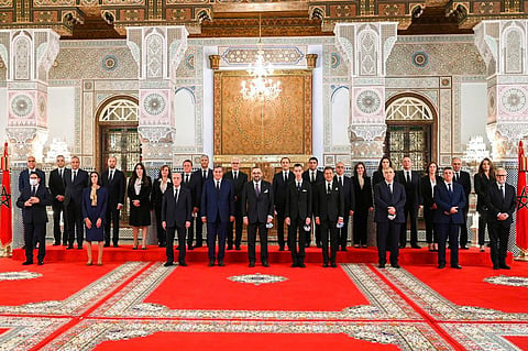 In this photo released by the Royal Palace, front row Morocco's King Mohammed VI, center, poses with all members of the new government of Morocco. (Photo | AP)
