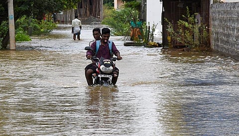 Residents commuting through the waterlogged street at Lingam Nagar and Rajalakshmi Nagar in Tiruchy. (Photo | M K Ashok Kumar, EPS)