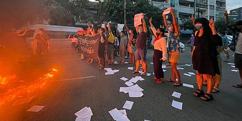 A small group of protesters hold a flash mob rally calling for a boycott of the education system under the military government that ousted Myanmar leader Aung San Suu Kyi in Yangon. (Photo | AP)