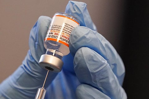 Paramedic Rebecca Hoke prepares a dose of the Pfizer-BioNTech COVID-19 vaccine for children 5 to 12 years old. (Photo | AP)