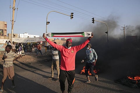 People protest in Khartoum, Sudan, Saturday, Nov. 13, 2021. Pro-democracy protesters took to the streets across Sudan to rally against the military's takeover last month. (Photo | AP)