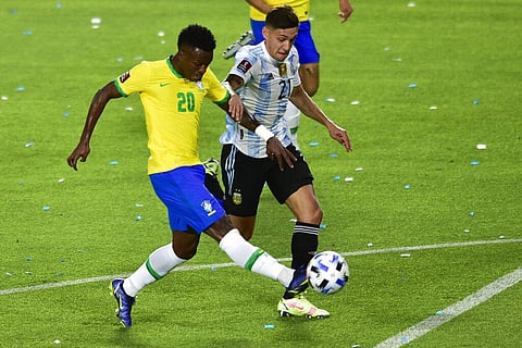 Brazil's Vini Jr, left, and Argentina's Nahuel Molina battle for the ball during a qualifying soccer match for the FIFA World Cup Qatar 2022 (Photo | AP)