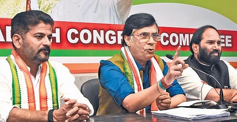 AICC national spokesperson Pawan Khera speaks to the media at Gandhi Bhavan on Tuesday. Also seen are TPCC president A Revanth Reddy and Nalgonda MP N Uttam Kumar Reddy. (Photo | EPS, R V K Rao)