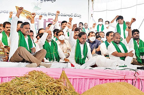 Telangana Chief Minister K Chandrasekhar Rao raises slogans as he stages a dharna along with other TRS leaders at Indira Park in Hyderabad on Thursday, Nov 18, 2021. (Photo | Vinay Madapu)