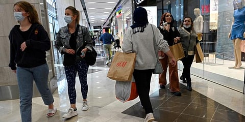 People walk in a shopping mall as retail businesses reopen to the public after a 106-day lockdown against the COVID-19 coronavirus, in Sydney. (Photo | AFP)