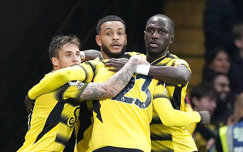 Watford's Joshua King celebrates with teammates after scoring goal during match against Manchester United at Vicarage Road, Watford, England, Saturday. (Photo | AP)