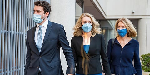 Elizabeth Holmes (C) walks into federal court in San Jose, Calif. (Photo | AP)