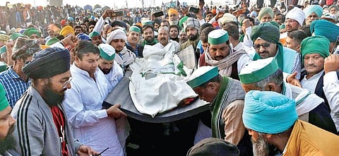 FILE | Protesters pay tributes to their fellow farmer Galtan Singh who died at Ghazipur border in New Delhi during protest against the farm laws | Express