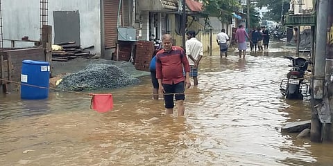 Surplus water from major lakes flowed into residential areas in Tiruchy on Sunday, Nov 29, 2021. (Photo | Express)