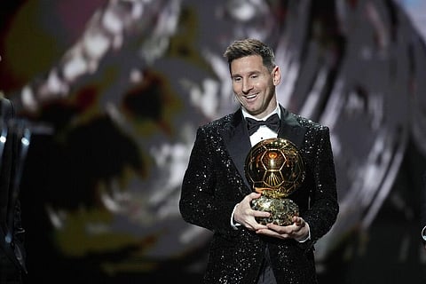 Argentina and PSG player Lionel Messi reacts after winning 2021 Ballon d'Or trophy at Theatre du Chatelet, in Paris, Monday, Nov. 29, 2021. (Photo | AP)