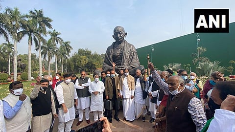 Oppositon MPs protest on RS Chairman rejecting revocation of the suspension of 12 Opposition MPs. (Photo | ANI)