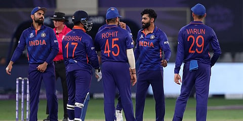 India's Ravindra Jadeja, second right, and teammates celebrate the dismissal of Scotland's Richie Berrington. (Photo | AP)