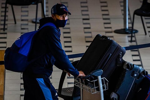 England's captain Joe Root arrives with team members ahead of the Ashes cricket series against Australia, at the international airport in Brisbane on November 6, 2021. (Photo | AFP)