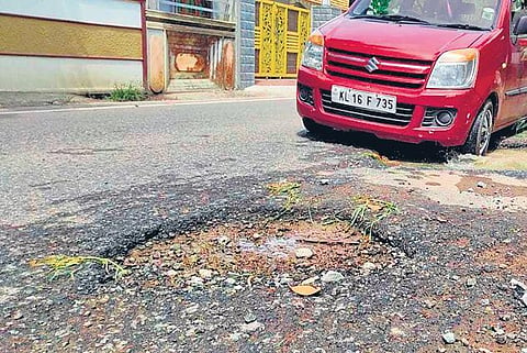 A huge pothole at Aralumoodu on the Balaramapuram - Kaliyikkavila stretch