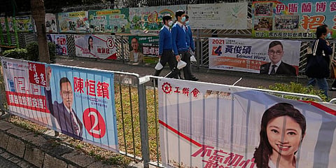 Banners of legislative election candidates are displayed on a street in Hong Kong, Thursday, Dec. 16, 2021. (Photo | AP)