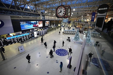 People pass through during the morning rush-hour at Waterloo railway station in London. (File Photo | AP)