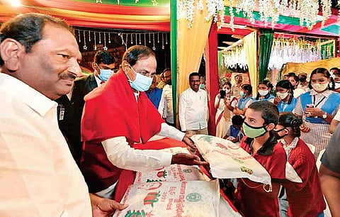 Chief Minister K Chandrasekhar Rao hands over gifts to children during the Christmas celebrations hosted by the government in Hyderabad on Tuesday, Dec 21.