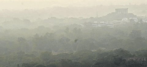 The Taramati Baradari is barely visible due to the haze at 3 pm on Tuesday, Dec 21, 2021. (Photo | S Senbagapandiyan)