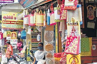 Cloth bags for sale in a shop | Express