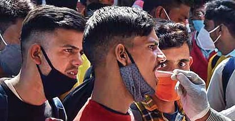 A man gives his sample at KSR Railway Station in Bengaluru | Vinod Kumar T