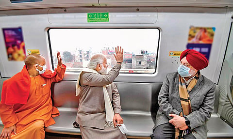 UP CM Yogi Adityanath, PM Narendra Modi and Union Minister Hardeep Singh Puri travel by metro in Kanpur on Tuesday. (Photo | PTI)