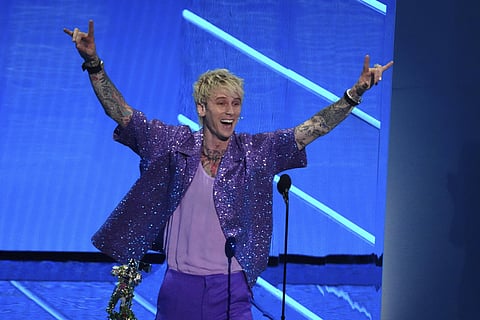 Machine Gun Kelly accepts the award for best alternative song for 'My Ex's Best Friend' at the MTV Video Music Awards 2021. (File Photo | AP)