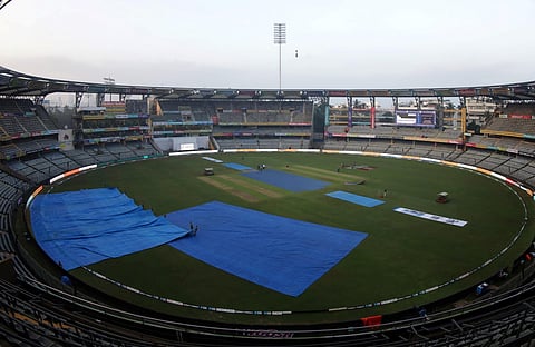 The Wankhede stadium pitch covered owing to rains on Thursday morning. (Photo | BCCI Twitter)
