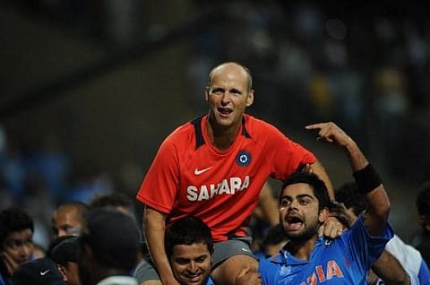 Indian cricketers hoist Gary Kirsten (C) onto their shoulders after victory in the Cricket World Cup 2011 final (File photo | AFP)