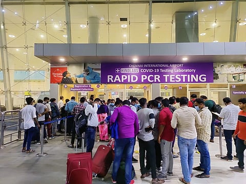 Passengers waiting infront of Rapid PCR centre at Chennai International Airport. (Photo | Express)